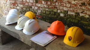 construction-hardhats-brick-bkgd